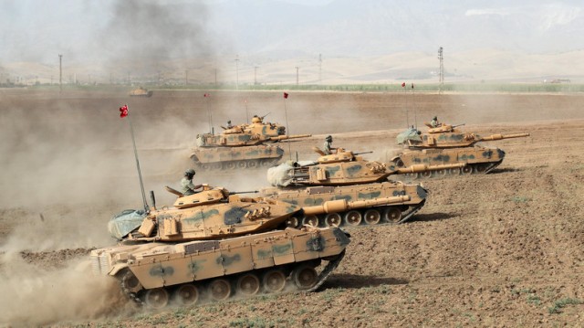 Turkish tanks manoeuvre during military exercise near Turkish-Iraqi border in Silopi